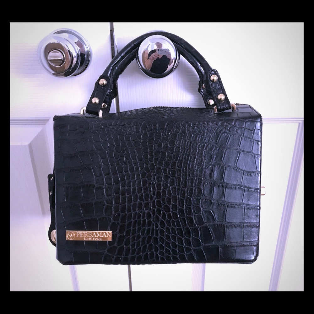Black leather PERSAMAN handbag w/ gold zipper.